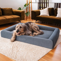 Brooklyn Ortho Pro orthopaedic memory foam dog bed in Chalk Grey with an Irish Wolfhound lying on it in a living room